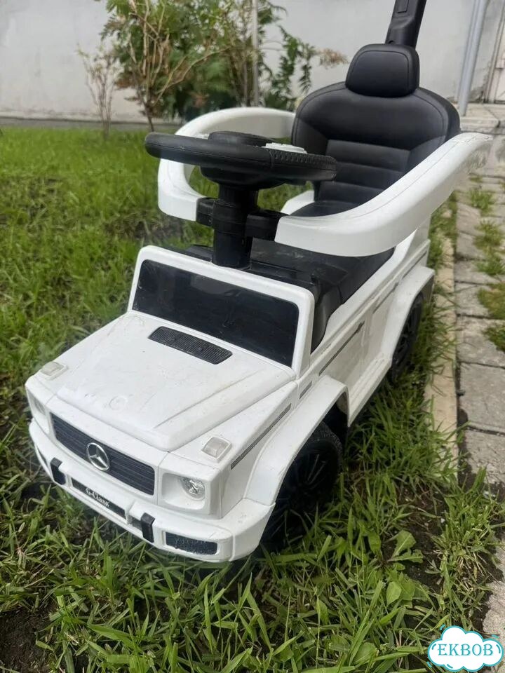 Машинка каталка с родительской ручкой фото 1